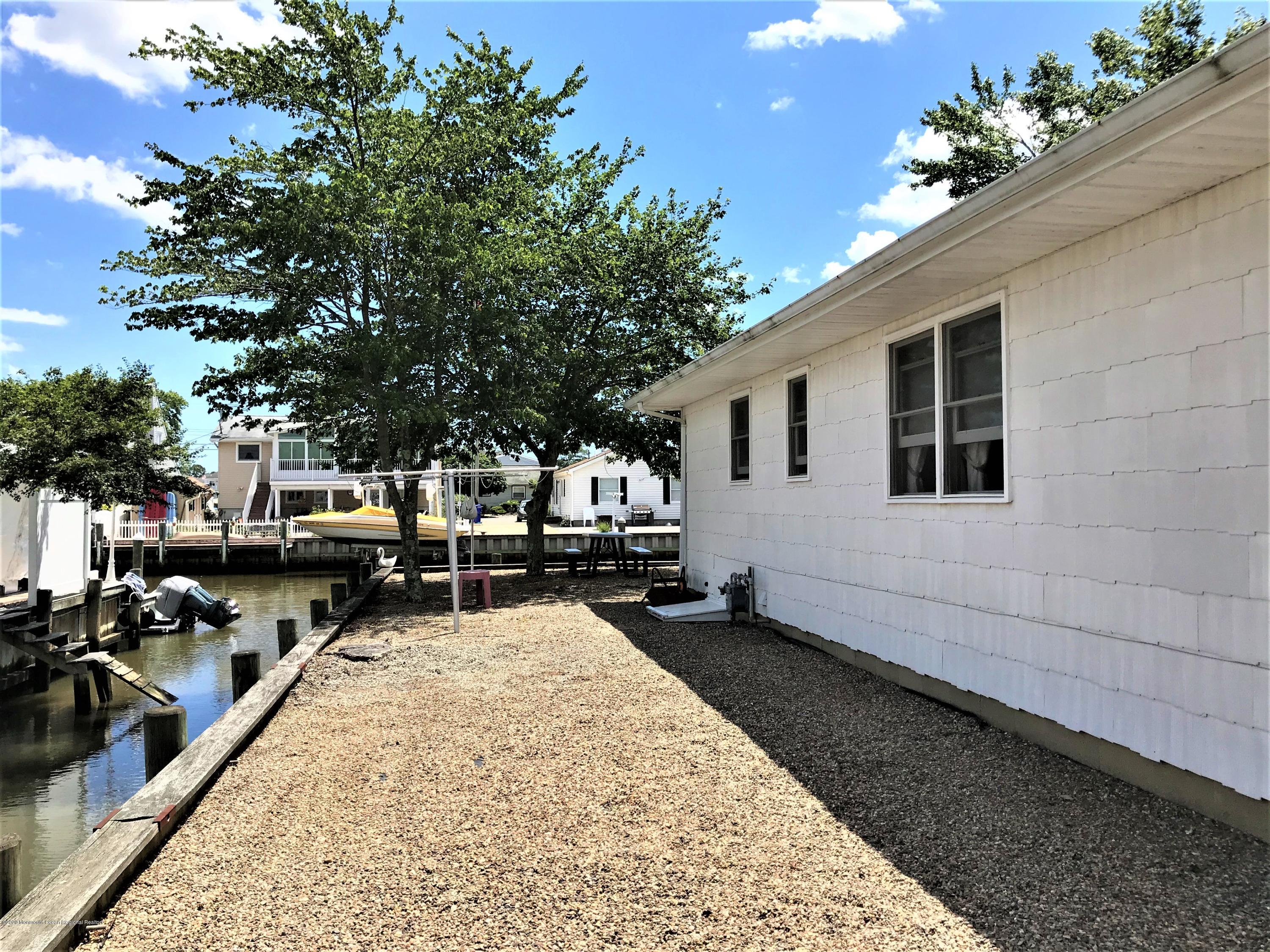 63 Mizzen Road Brick, NJ 08723 - Photo 36 of 37 a swimming pool with outdoor seating and yard