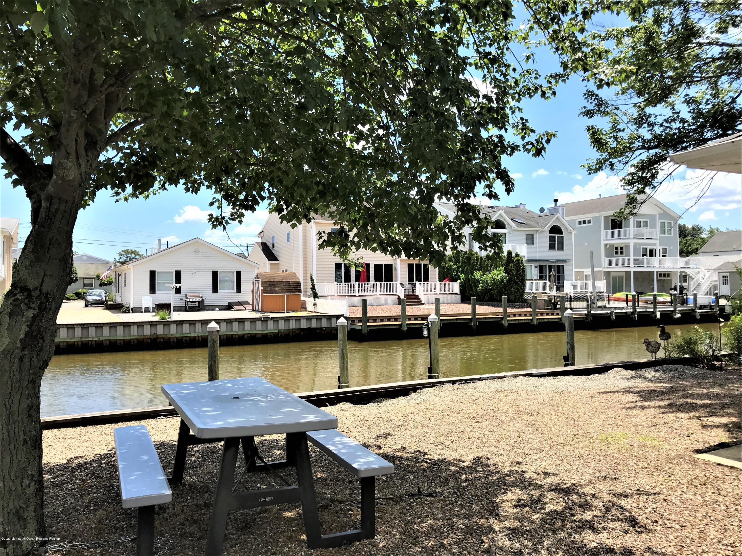 63 Mizzen Road Brick, NJ 08723 - Photo 4 of 37 a view of a lake with house