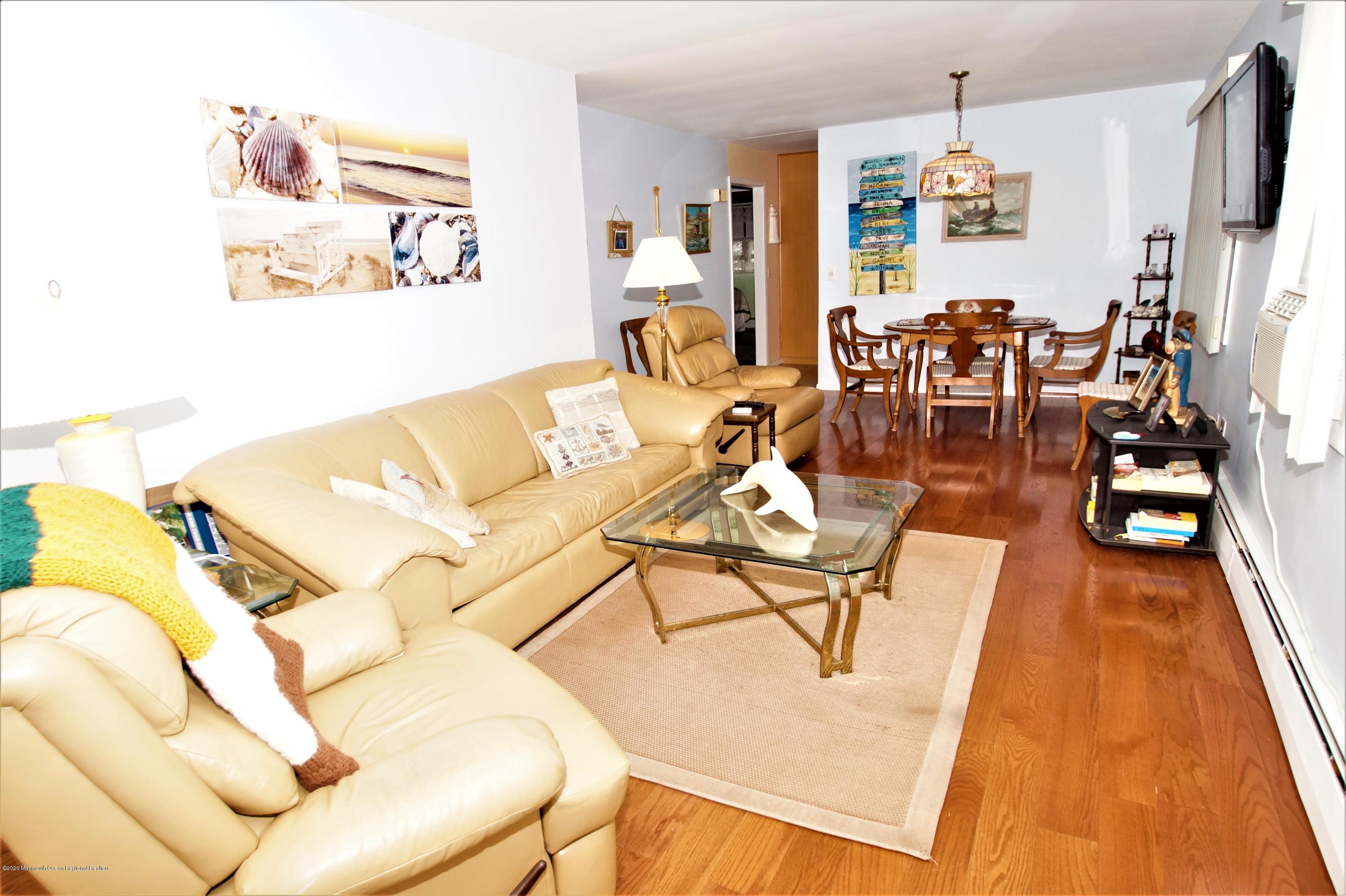 63 Mizzen Road Brick, NJ 08723 - Photo 7 of 37 a living room with furniture and a flat screen tv