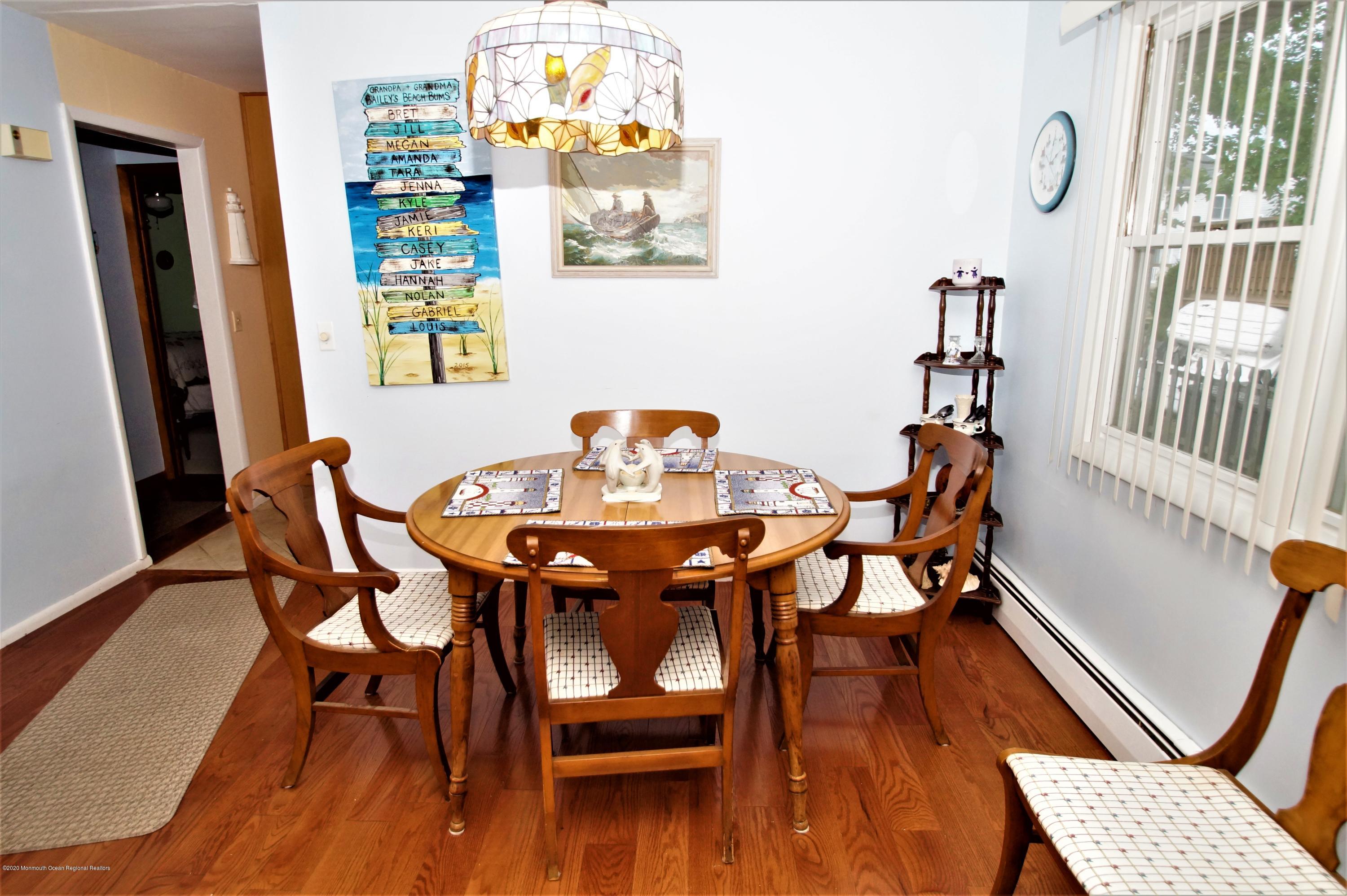 63 Mizzen Road Brick, NJ 08723 - Photo 8 of 37 a dining room with furniture and wooden floor