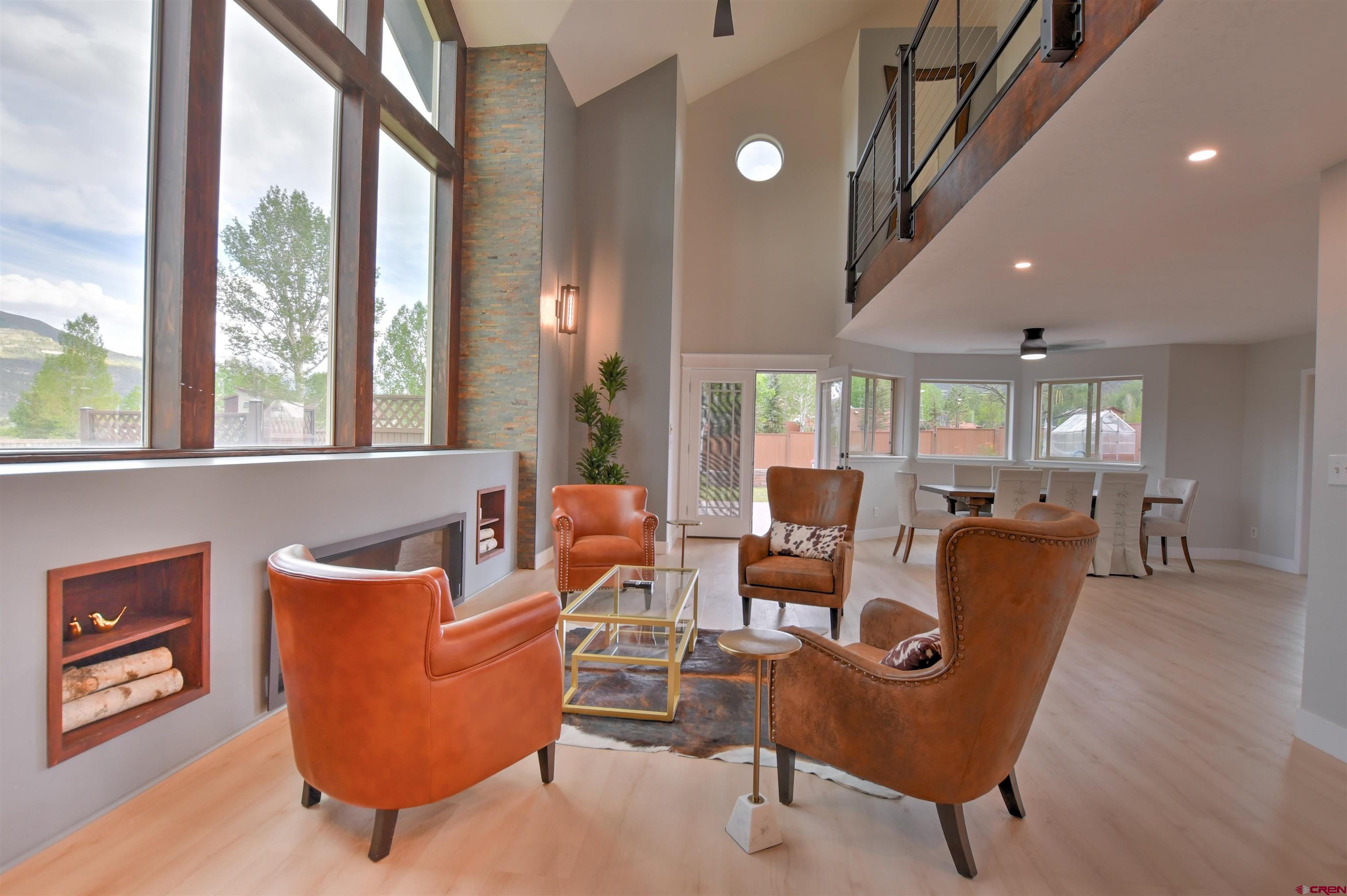 602 Chipeta Drive Ridgway, CO 81432 - Photo 37 of 41 a dining room with furniture and a floor to ceiling window