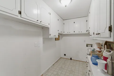 a view of cabinets with wooden floor