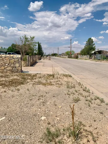 a view of a swimming pool and a yard