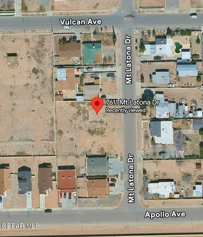 a view of a big yard with a large tree