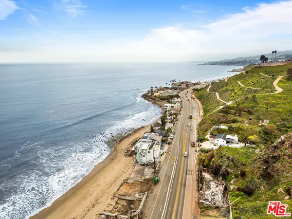 a view of a yard with an ocean view
