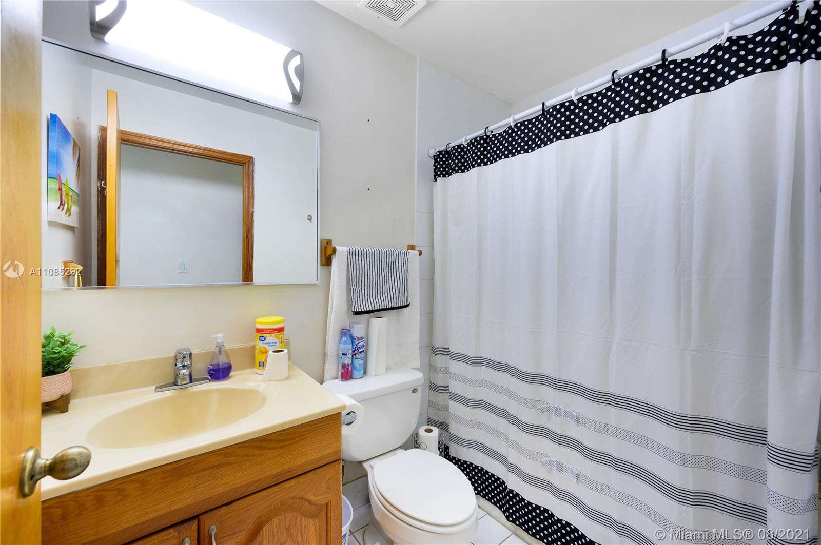 14468 Southwest 50th Terrace Miami, FL 33175 - Photo 11 of 15 a bathroom with a sink toilet and shower