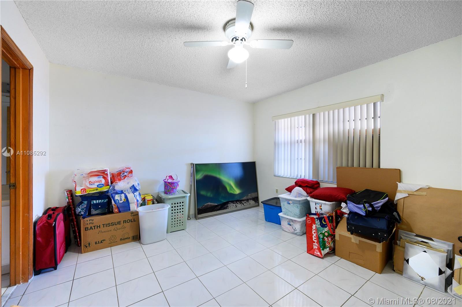 14468 Southwest 50th Terrace Miami, FL 33175 - Photo 12 of 15 a living room with furniture and a flat screen tv