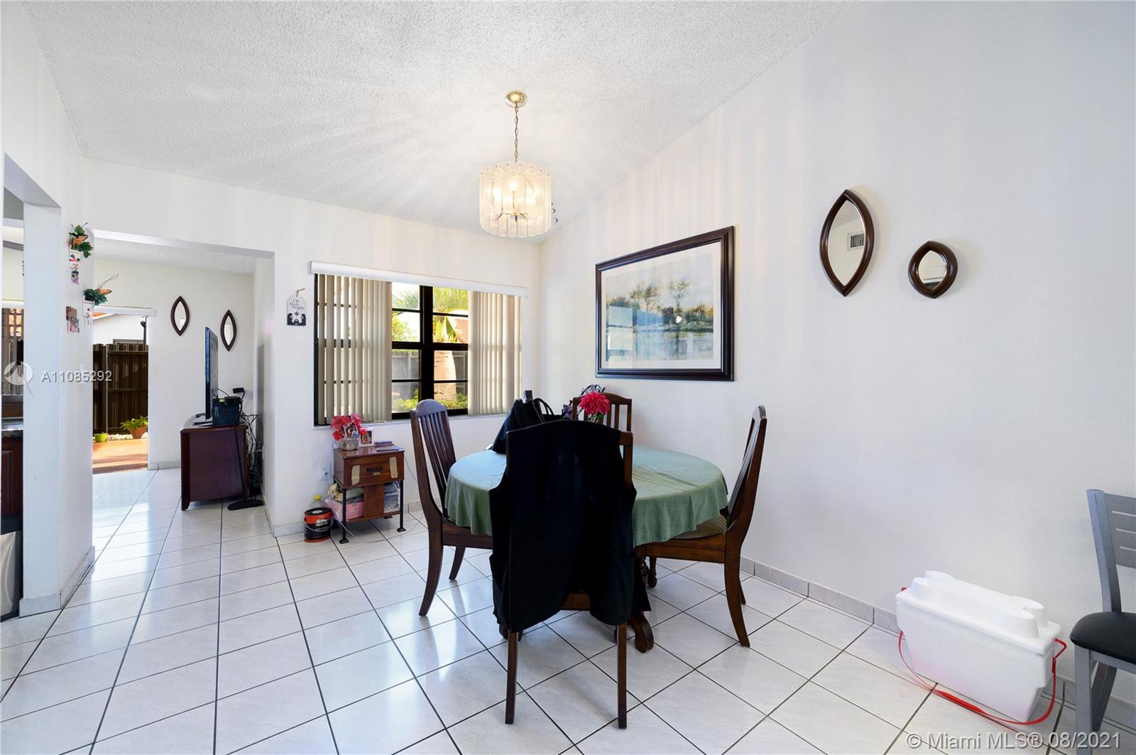 14468 Southwest 50th Terrace Miami, FL 33175 - Photo 14 of 15 a view of a dining room with furniture