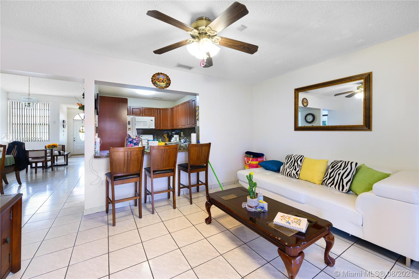 14468 Southwest 50th Terrace Miami, FL 33175 - Photo 3 of 15 a living room with furniture and a large window