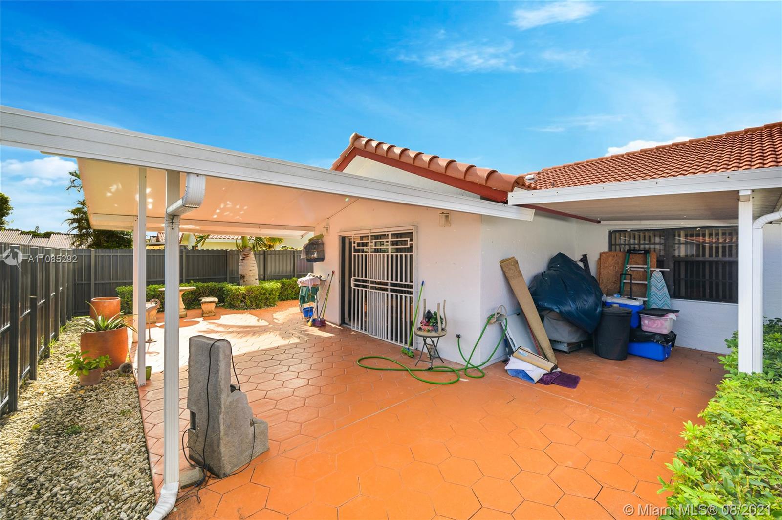 14468 Southwest 50th Terrace Miami, FL 33175 - Photo 7 of 15 a view of a patio with table and chairs next to a yard