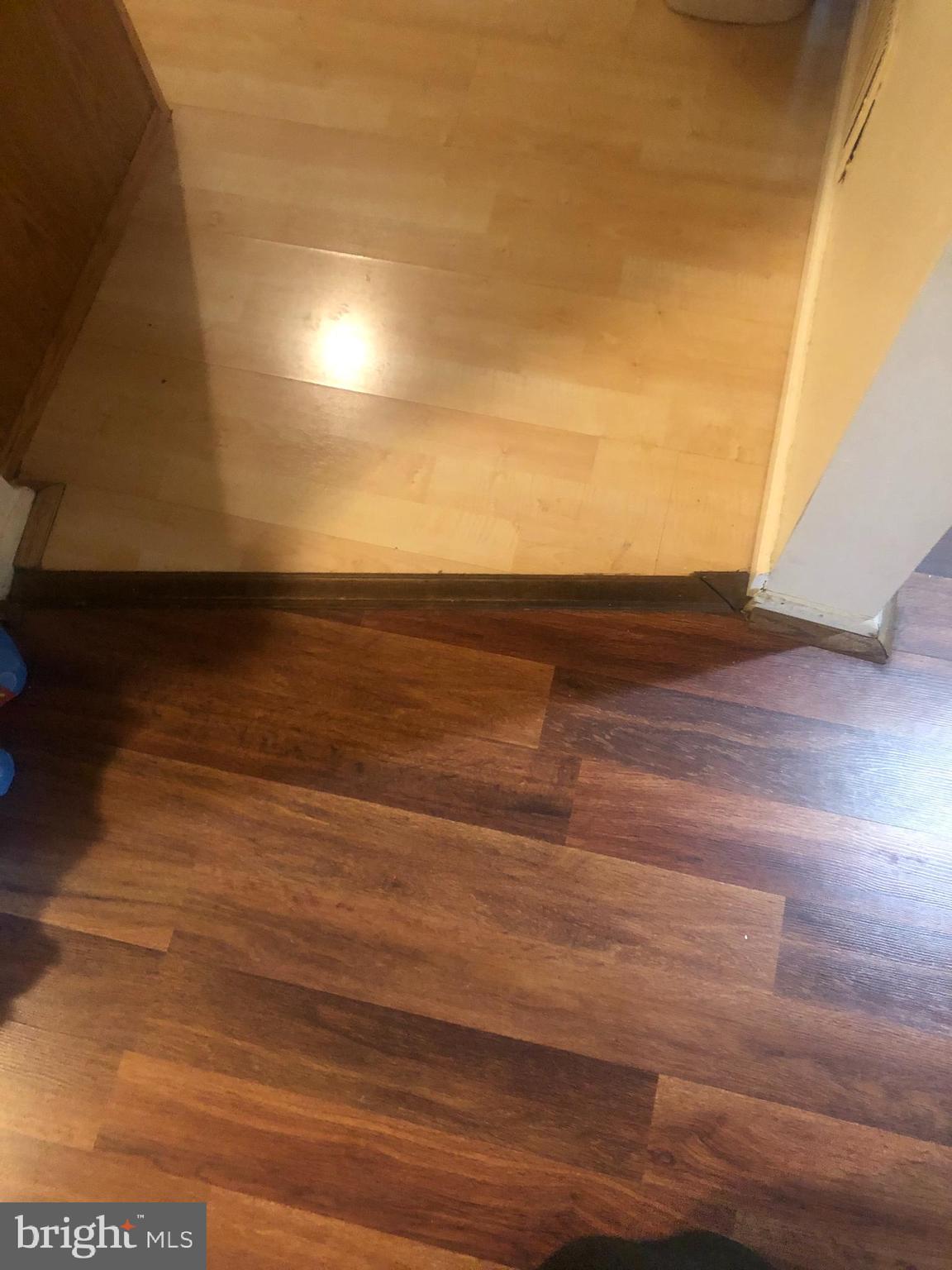 11245 Powder Run, Unit 104 Columbia, MD 21044 - Photo 22 of 42 floor from kitchen to living/dining