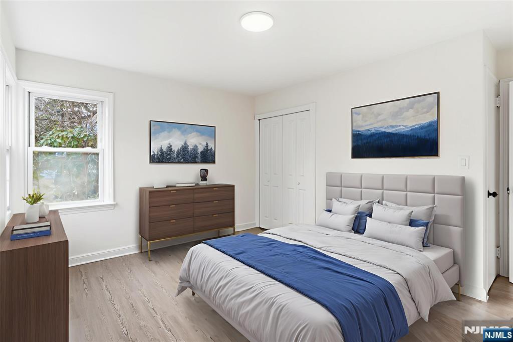 703 Elm Street Roselle, NJ 07203 - Photo 11 of 17 a bedroom with a bed and a window