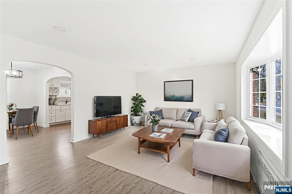 703 Elm Street Roselle, NJ 07203 - Photo 2 of 17 a living room with furniture and a flat screen tv