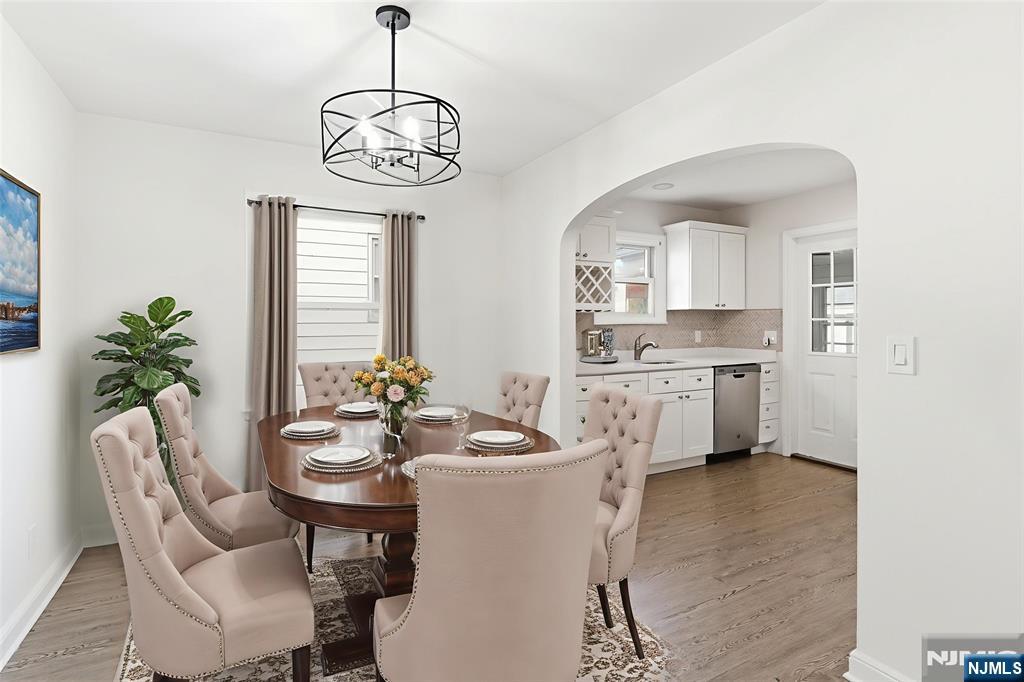 703 Elm Street Roselle, NJ 07203 - Photo 3 of 17 a view of a dining room with furniture window and wooden floor