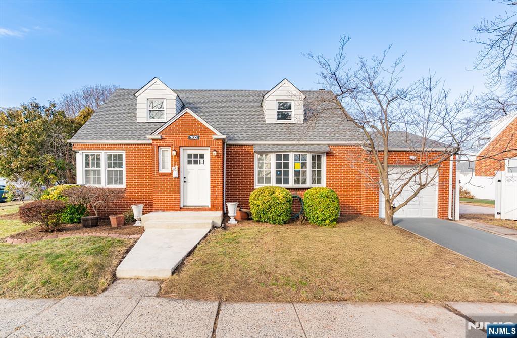 703 Elm Street Roselle, NJ 07203 - Photo 5 of 17 a front view of a house with a yard