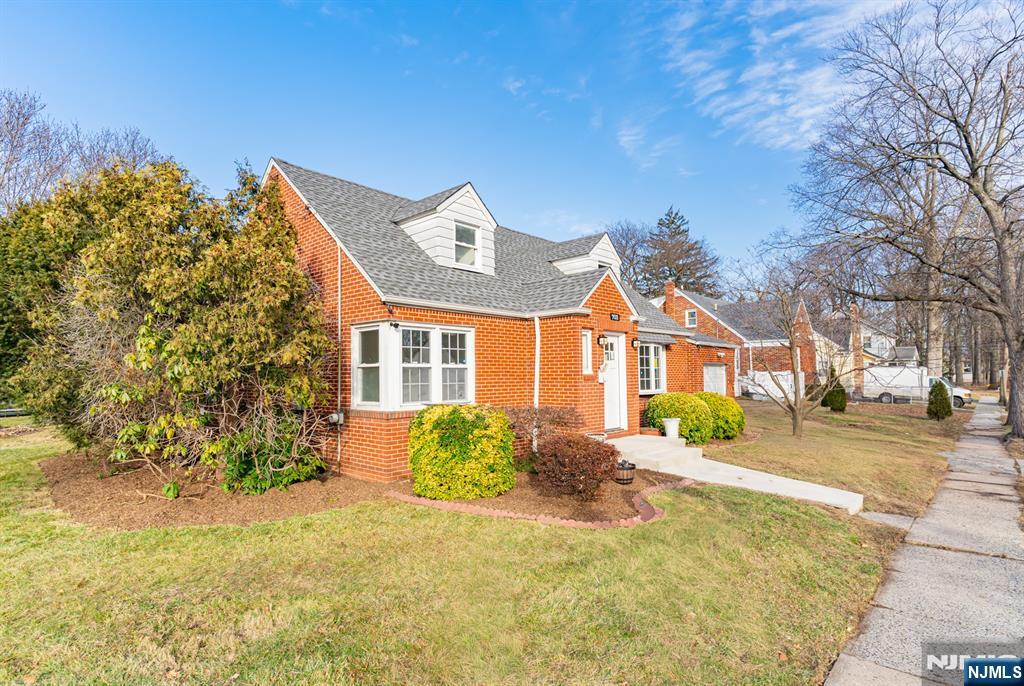 703 Elm Street Roselle, NJ 07203 - Photo 6 of 17 a front view of a house with a yard