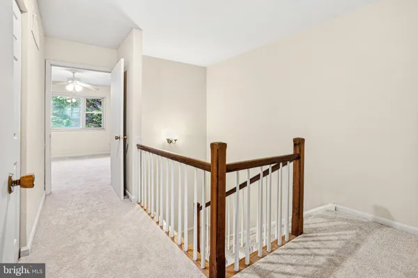 a view of a hallway with a window