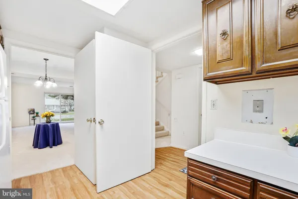 a room with wooden floor and furniture