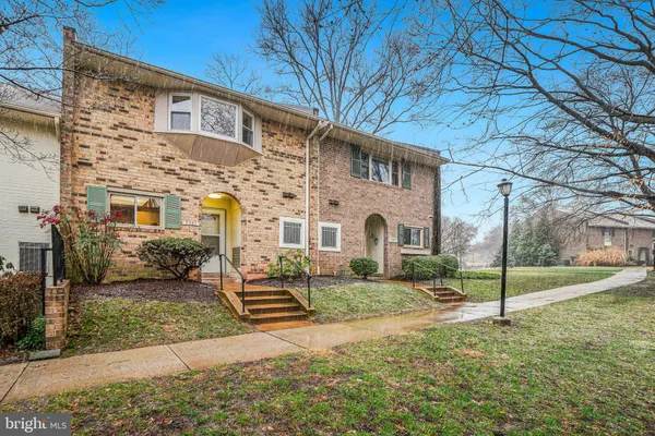 a view of a large building next to a yard