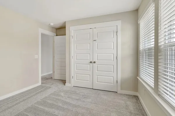 an empty room with a empty space and window