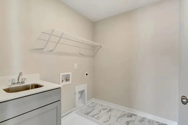 a bathroom with a sink and cabinets