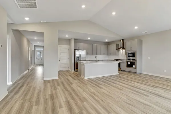 a view of kitchen with wooden floor