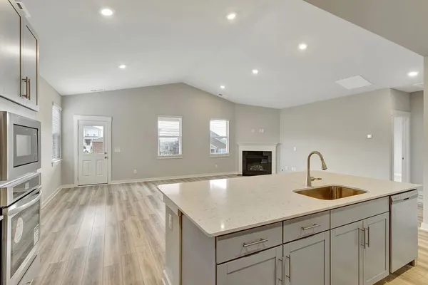a kitchen with sink and microwave