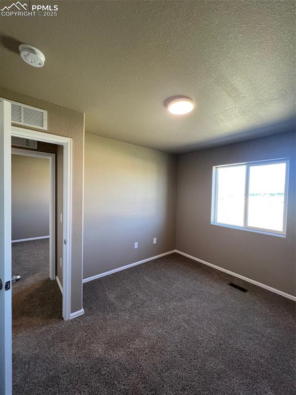 1874 Sandtoft Heights Colorado Springs, CO 80951 - Photo 15 of 31 an empty room with a empty space and windows