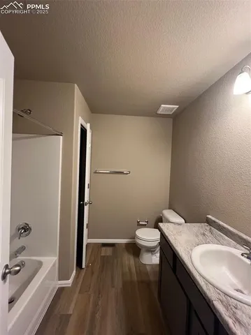 a room with water heater and a cabinet