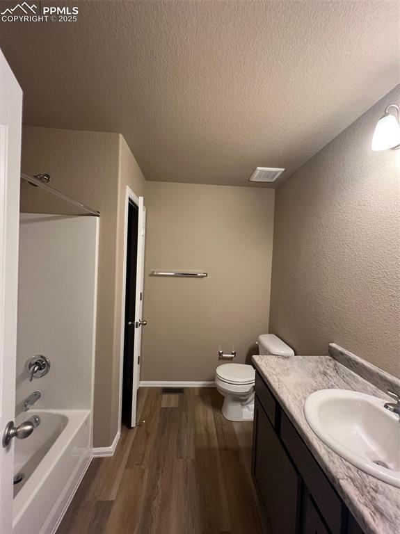 1874 Sandtoft Heights Colorado Springs, CO 80951 - Photo 18 of 31 a bathroom with a granite countertop sink toilet and shower