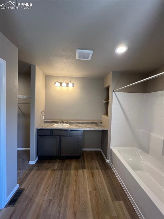 1874 Sandtoft Heights Colorado Springs, CO 80951 - Photo 25 of 31 a bathroom with a bathtub and a sink
