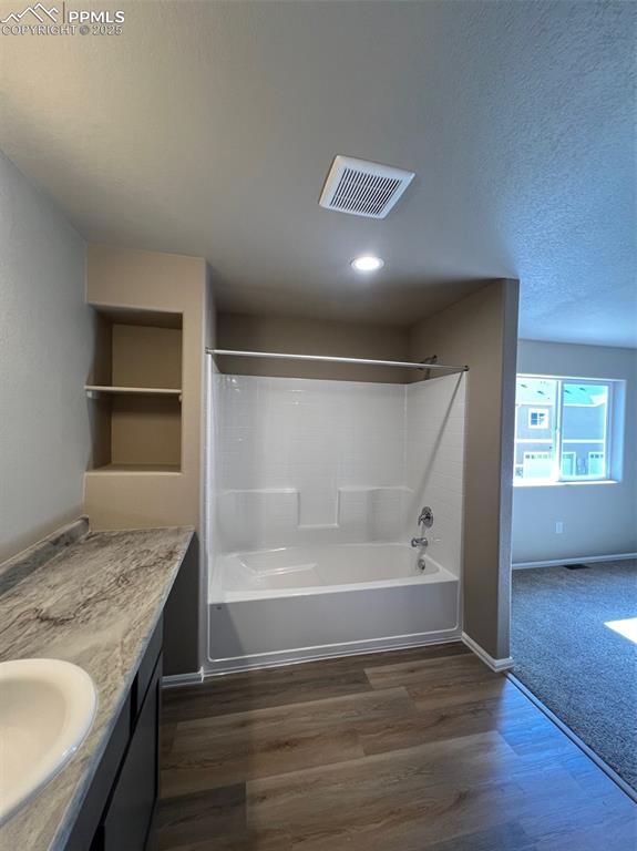 1874 Sandtoft Heights Colorado Springs, CO 80951 - Photo 29 of 31 a bathroom with granite countertop a sink and bathtub