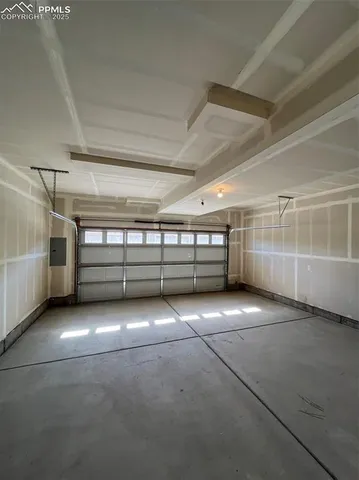a view of a brick house with a wooden fence