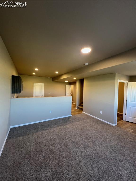 1874 Sandtoft Heights Colorado Springs, CO 80951 - Photo 3 of 31 an empty room with windows and fireplace