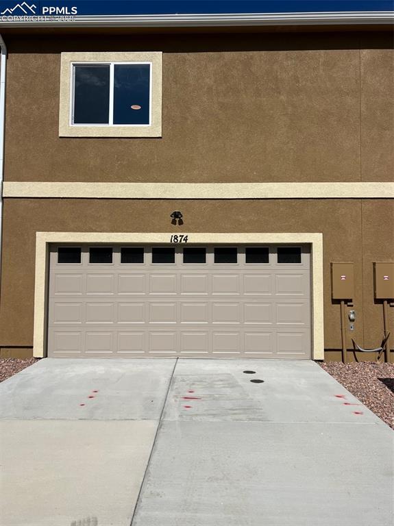 1874 Sandtoft Heights Colorado Springs, CO 80951 - Photo 31 of 31 a view of a brick house with a wooden fence