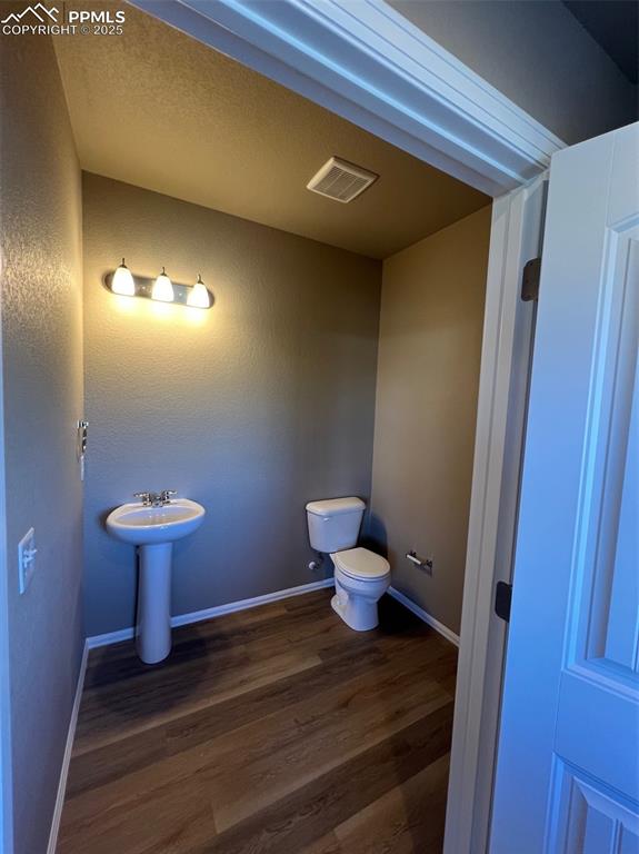 1874 Sandtoft Heights Colorado Springs, CO 80951 - Photo 4 of 31 a bathroom with a toilet