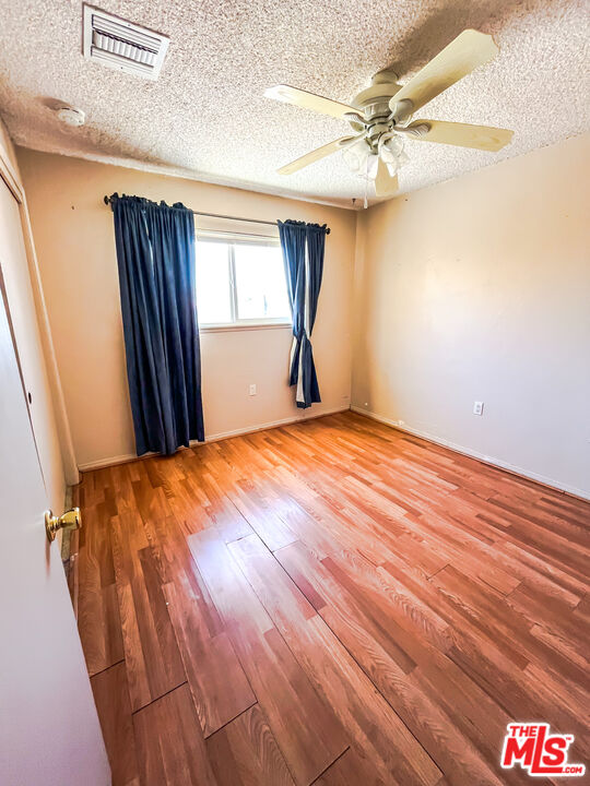 1001 South McCall Street Ridgecrest, CA 93555 - Photo 16 of 27 a view of a livingroom with a chandelier