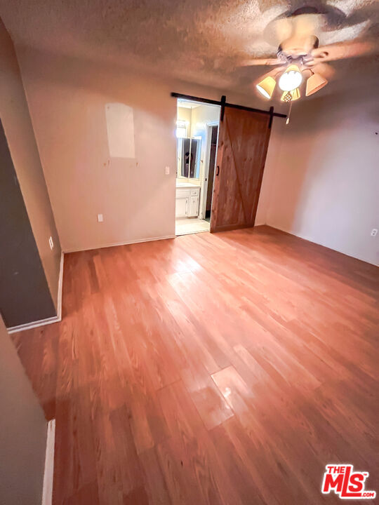 1001 South McCall Street Ridgecrest, CA 93555 - Photo 18 of 27 a view of an empty room with a chandelier