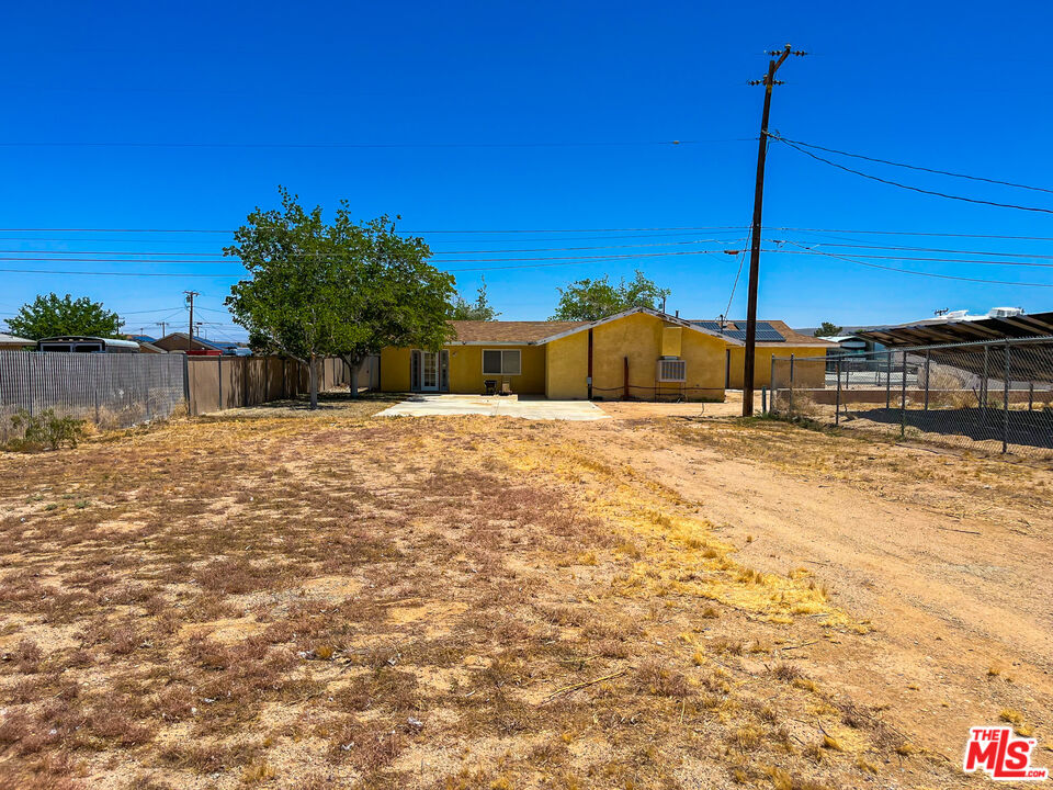 1001 South McCall Street Ridgecrest, CA 93555 - Photo 27 of 27 a view of a house with a yard