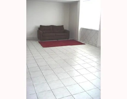 a living room with a rug