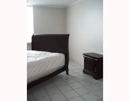 a bedroom with a bed and a cabinets