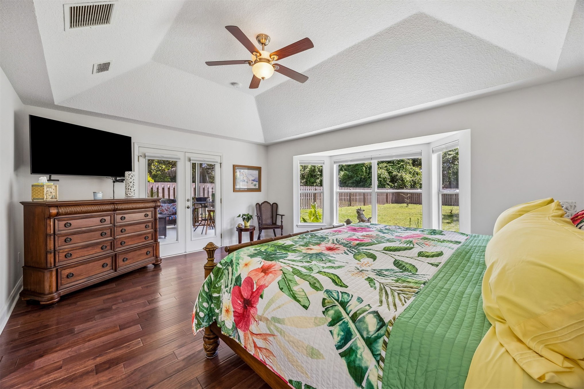 86107 Remsenburg Drive Fernandina Beach, FL 32034 - Photo 14 of 58 a bed room with a bed a television and a large window