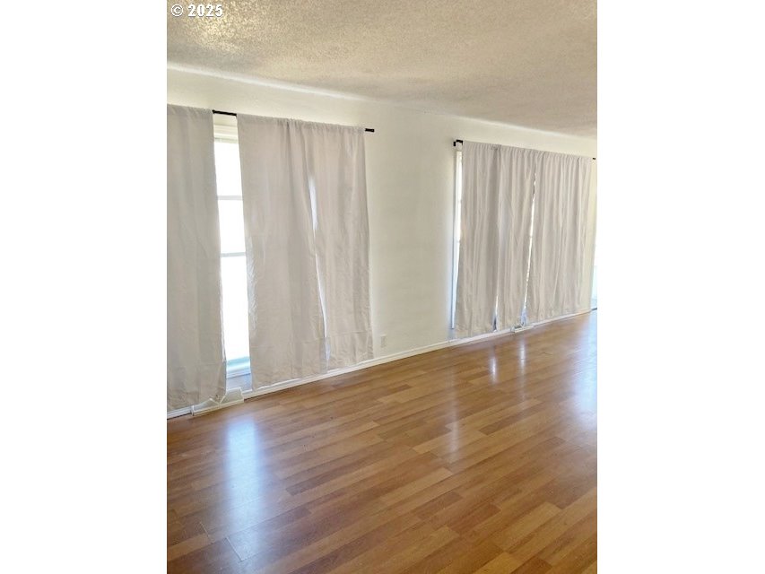727 Southwest 28th Street Pendleton, OR 97801 - Photo 3 of 12 a view of a livingroom with wooden floor