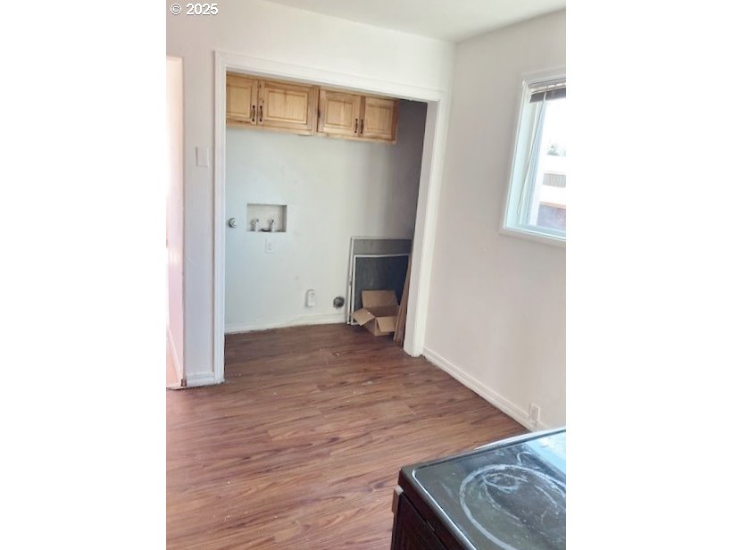 727 Southwest 28th Street Pendleton, OR 97801 - Photo 7 of 12 a view of a hallway with wooden floor