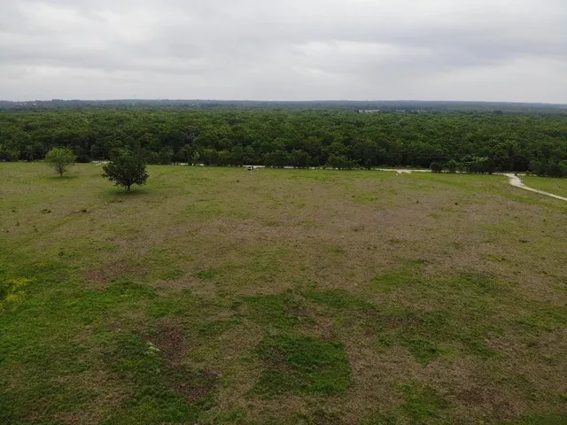 a view of a lake with a yard