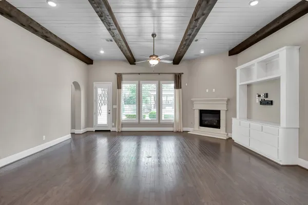 a bathroom with a granite countertop sink and a bathtub