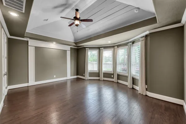 a view of living room with furniture and wooden floor