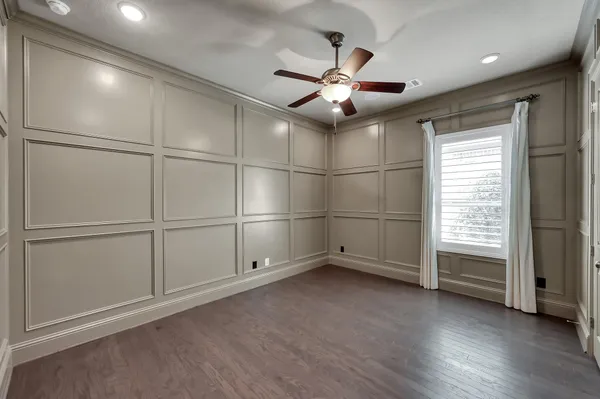 a bathroom with a sink mirror and toilet