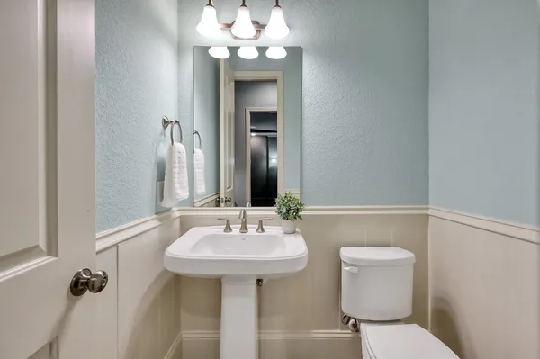 a view of a house with a garden and a patio