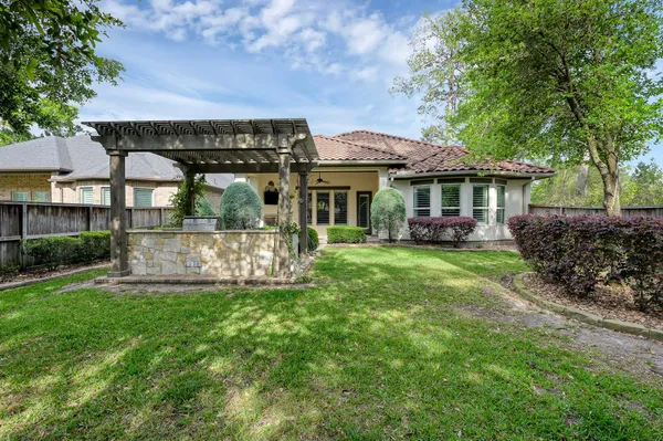 a view of a park with iron fence